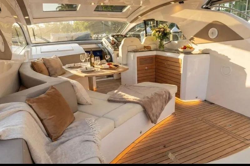 Slide: The Image of Luxurious bedroom in 2024 Sessa Marine C44 Cruiser with elegant decor and ambient lighting. - 4
