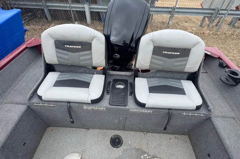 Slide: The Image of 2018 Tracker Pro Guide V-175 Combo boat seats with gray upholstery and black accents. - 5
