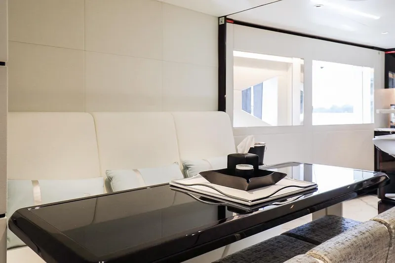 Slide: The Image of Luxurious interior of 2025 Majesty 120 yacht with sleek dining area and modern decor. - 36