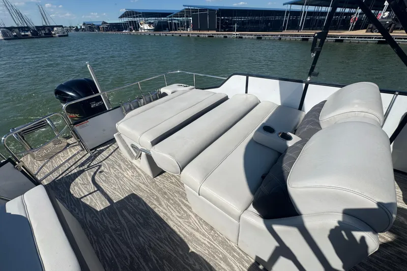 Slide: The Image of 2020 SunCatcher Elite 326 DLX SS pontoon boat with luxurious seating on a sunny day. - 13