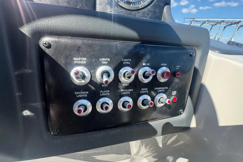 Slide: The Image of Control panel of 2020 SunCatcher Elite 326 DLX SS boat with various switches. - 25