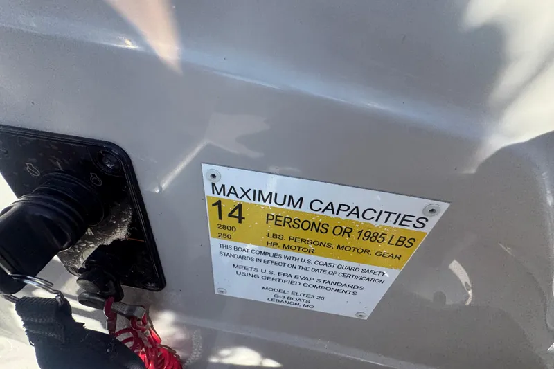 Slide: The Image of Capacity label on 2020 SunCatcher Elite 326 DLX SS boat, showing limits for persons and weight. - 27