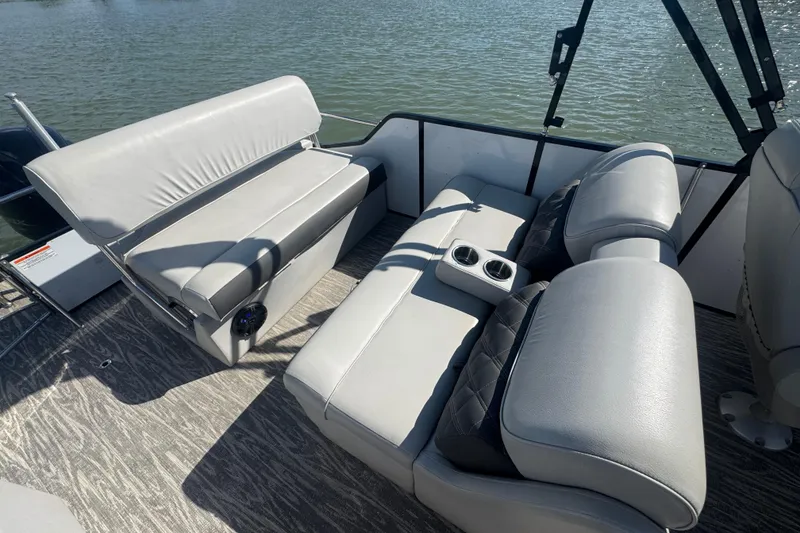 Slide: The Image of Luxurious seating on 2020 SunCatcher Elite 326 DLX SS pontoon boat with cup holders. - 29