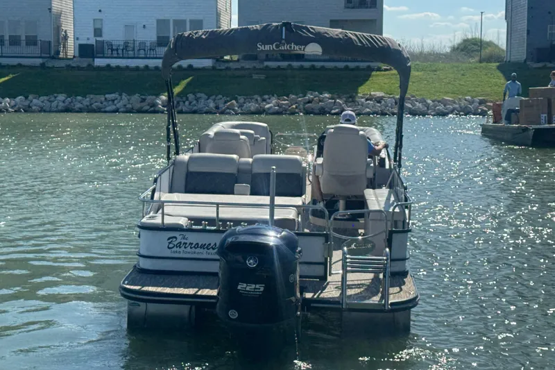 Slide: The Image of 2020 SunCatcher Elite 326 DLX SS pontoon boat on a sunny lake. - 4