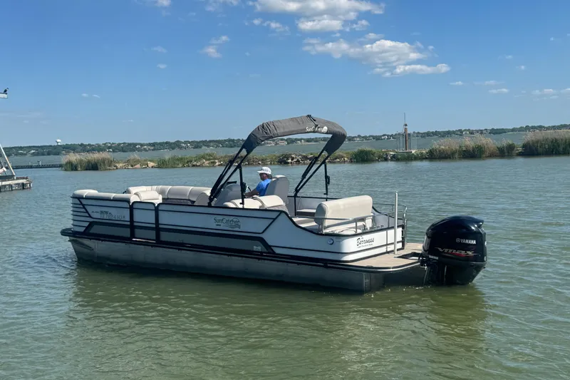 Slide: The Image of 2020 SunCatcher Elite 326 DLX SS pontoon boat on a lake with Yamaha engine. - 5