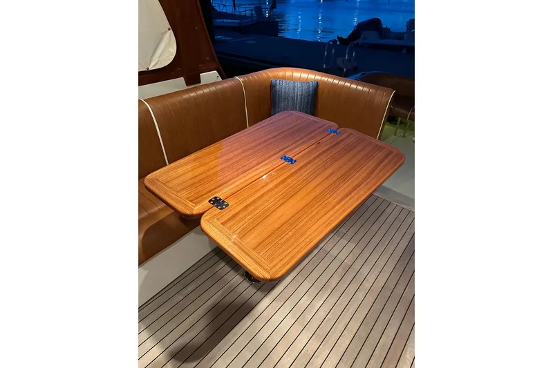 Slide: The Image of Luxurious interior of 2013 Hunt Yachts Harrier 36 with wooden table and leather seating. - 11