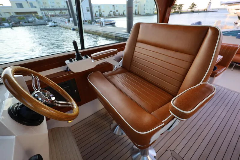 Slide: The Image of Luxurious helm seat and steering wheel on 2013 Hunt Yachts Harrier 36 boat. - 13