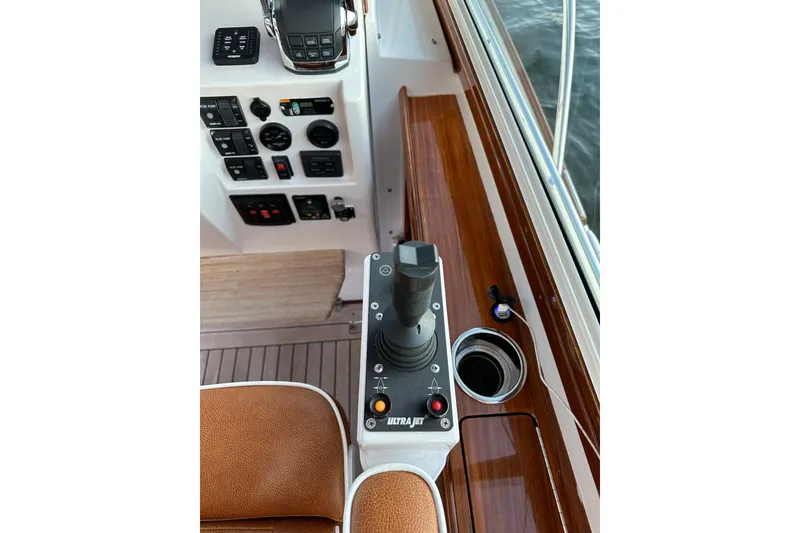 Slide: The Image of Control panel of 2013 Hunt Yachts Harrier 36 with joystick and gauges. - 15