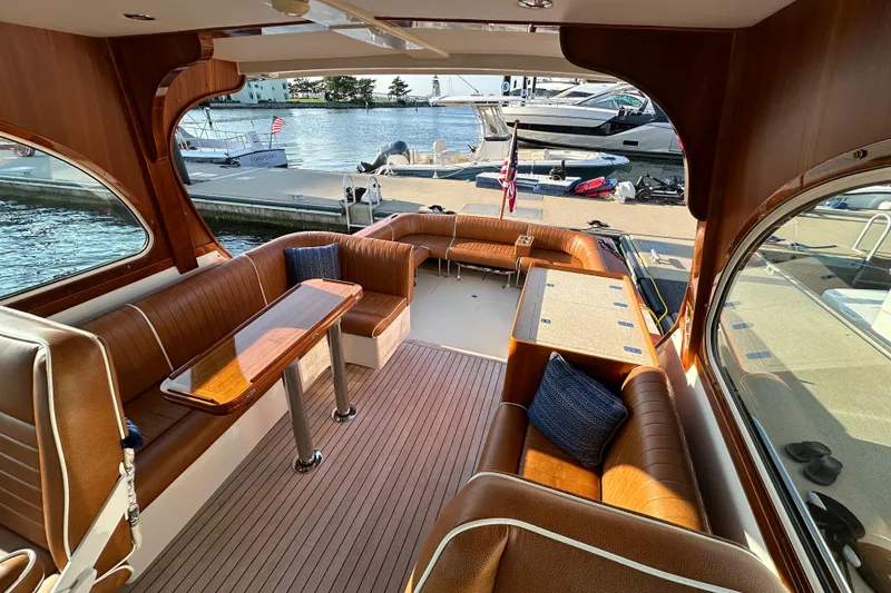 Slide: The Image of Luxurious 2013 Hunt Yachts Harrier 36 interior with elegant wood finish and waterfront view. - 17