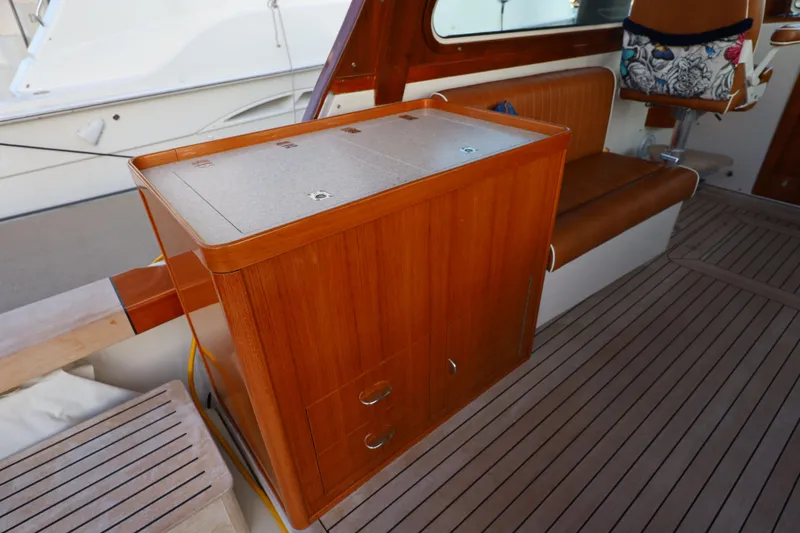 Slide: The Image of Interior of 2013 Hunt Yachts Harrier 36 with wooden cabinetry and seating. - 19