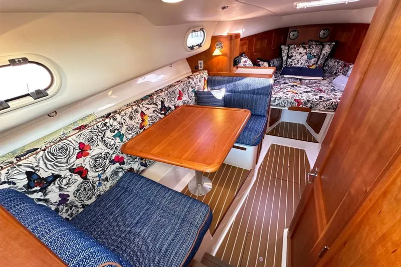 Slide: The Image of Luxurious 2013 Hunt Yachts Harrier 36 interior with elegant wood finishes and floral upholstery. - 22