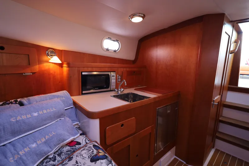 Slide: The Image of Cozy cabin interior of 2013 Hunt Yachts Harrier 36 with kitchenette and bedding. - 27