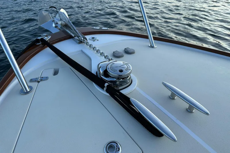 Slide: The Image of Bow of 2013 Hunt Yachts Harrier 36 with anchor and cleats on calm water. - 29
