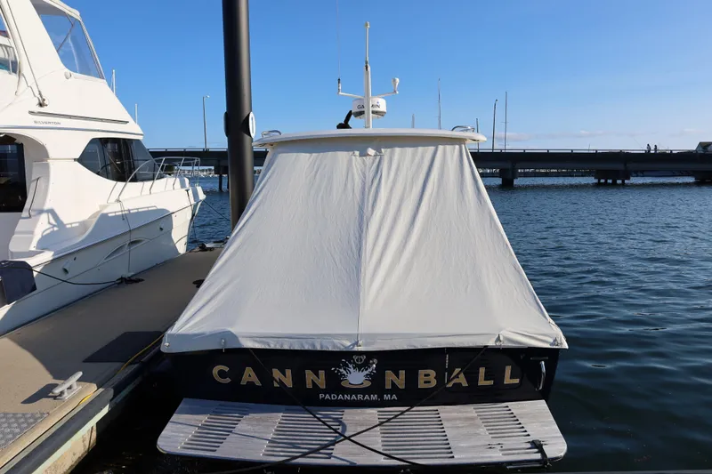 Slide: The Image of 2013 Hunt Yachts Harrier 36 docked, covered, with "Cannonball" name visible, Padarnaram, MA. - 35
