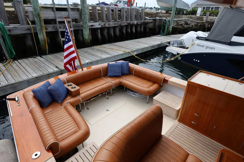 Slide: The Image of Luxurious 2013 Hunt Yachts Harrier 36 with elegant seating at a marina dock. - 7