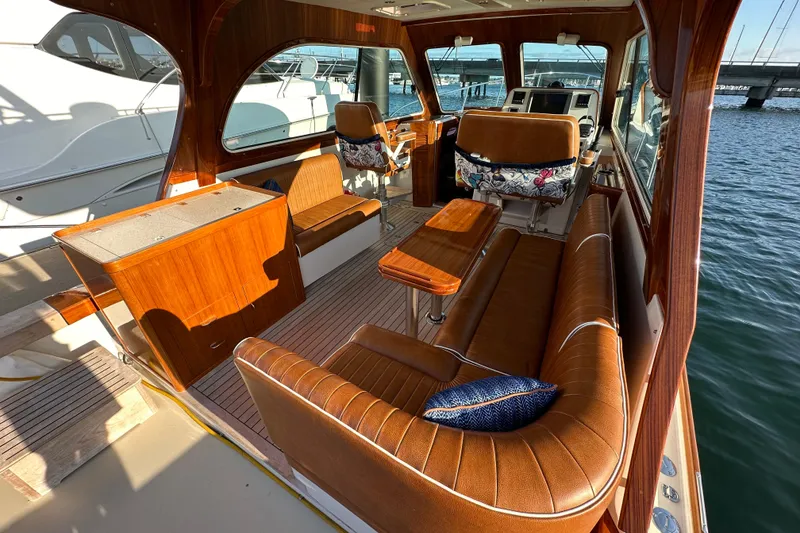 Slide: The Image of Luxurious interior of 2013 Hunt Yachts Harrier 36 with leather seating and wooden accents. - 8