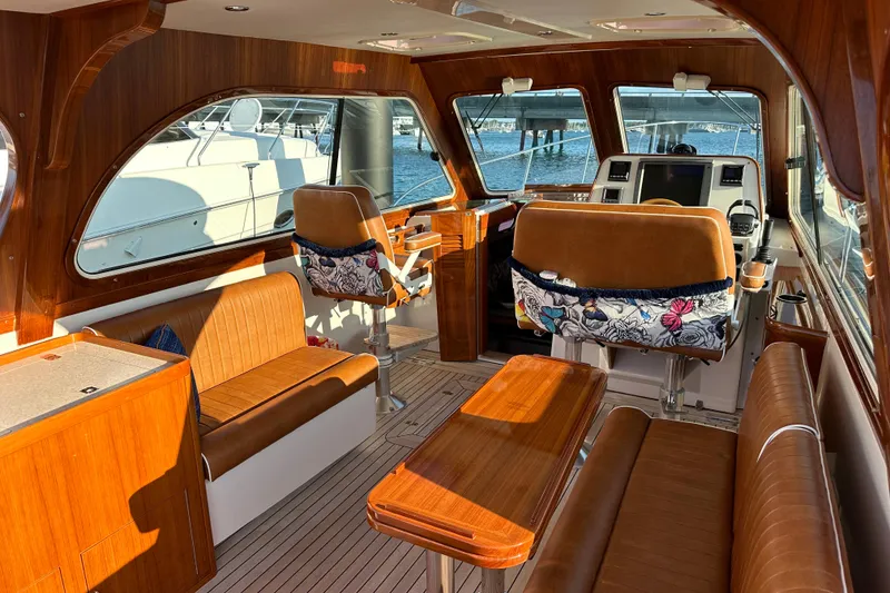 Slide: The Image of Luxurious 2013 Hunt Yachts Harrier 36 interior with elegant wood finish and leather seating. - 9