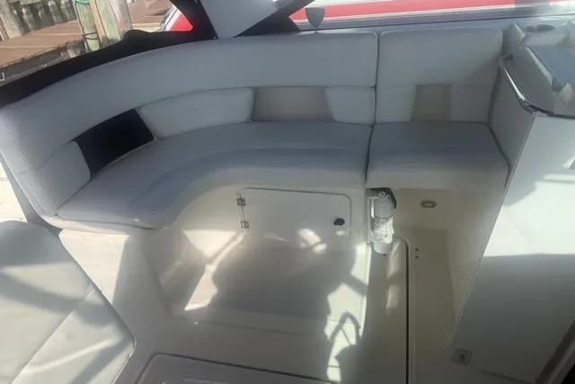 Slide: The Image of 2001 Tiara Yachts 2900 Open interior with white seating and storage compartment. - 16