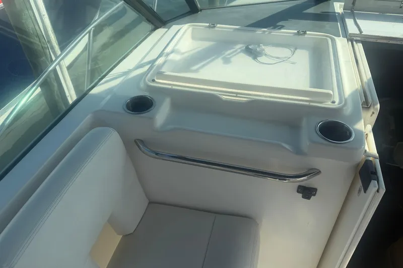 Slide: The Image of 2001 Tiara Yachts 2900 Open interior with seating and cup holders. - 17