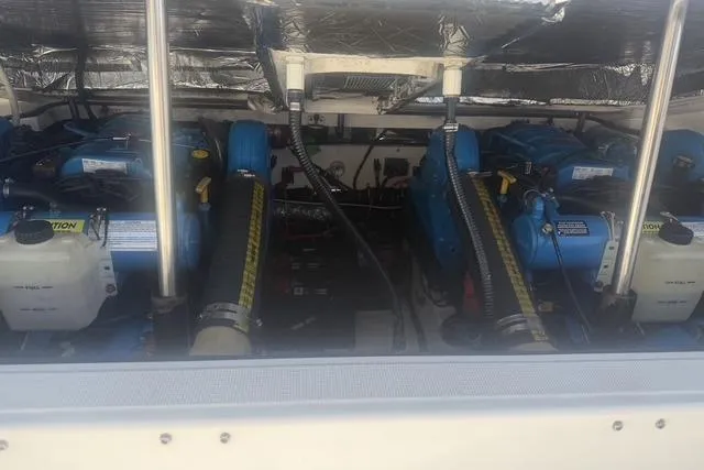 Slide: The Image of Engine compartment of a 2001 Tiara Yachts 2900 Open, showcasing dual blue engines. - 22
