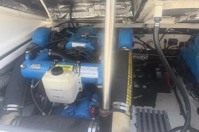 Slide: The Image of Engine compartment of a 2001 Tiara Yachts 2900 Open, showcasing mechanical components. - 23