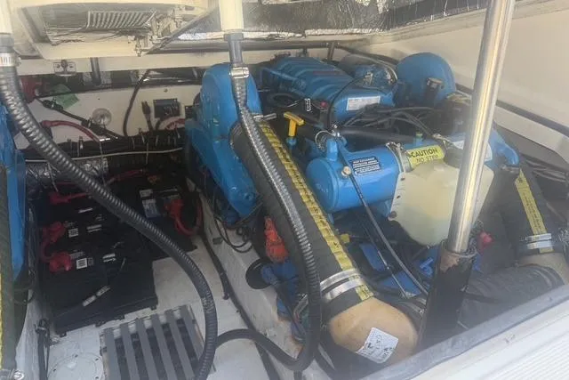 Slide: The Image of Engine compartment of a 2001 Tiara Yachts 2900 Open, showcasing blue marine engines. - 24