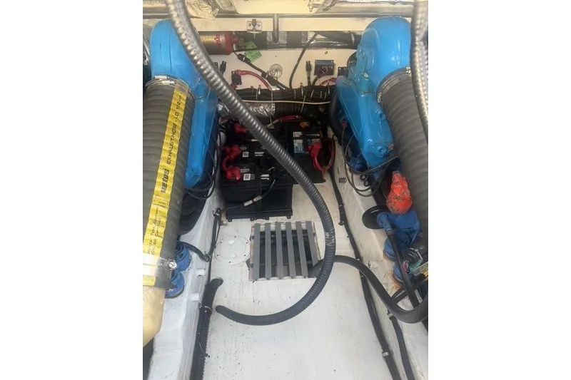 Slide: The Image of Engine compartment of a 2001 Tiara Yachts 2900 Open, featuring dual blue engines. - 25