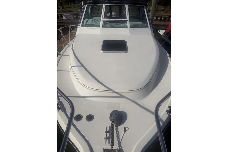 Slide: The Image of 2001 Tiara Yachts 2900 Open boat deck with anchor and hatch. - 28