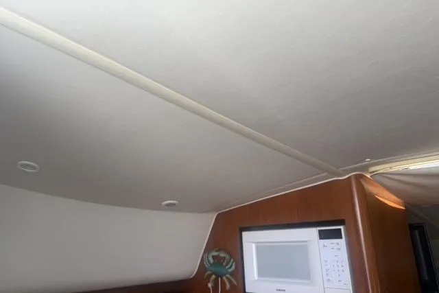 Slide: The Image of Interior of 2001 Tiara Yachts 2900 Open with microwave and ceiling detail. - 43