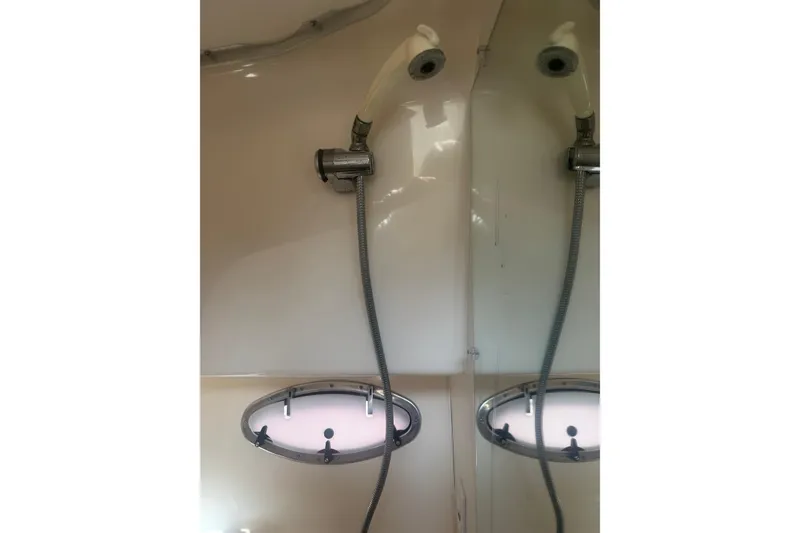 Slide: The Image of Shower area inside a 2001 Tiara Yachts 2900 Open boat with porthole window. - 49