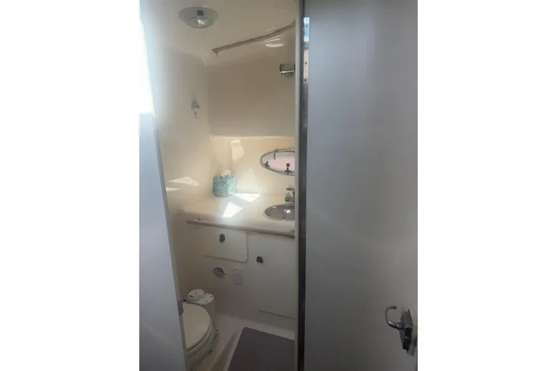 Slide: The Image of 2001 Tiara Yachts 2900 Open bathroom interior with sink and toilet. - 50
