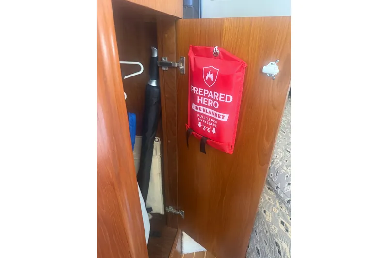 Slide: The Image of Fire blanket in a 2001 Tiara Yachts 2900 Open cabin closet. - 52