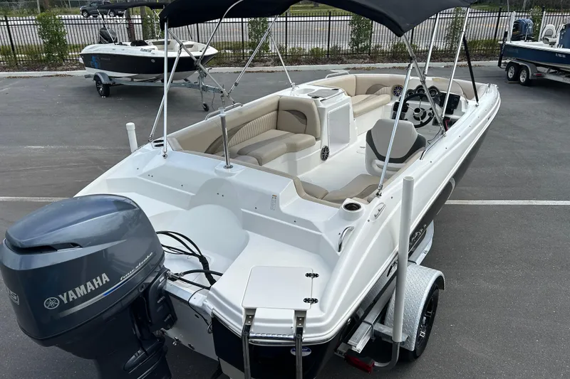 Slide: The Image of 2014 NauticStar 203SC Sport Deck boat with Yamaha outboard engine on trailer. - 7
