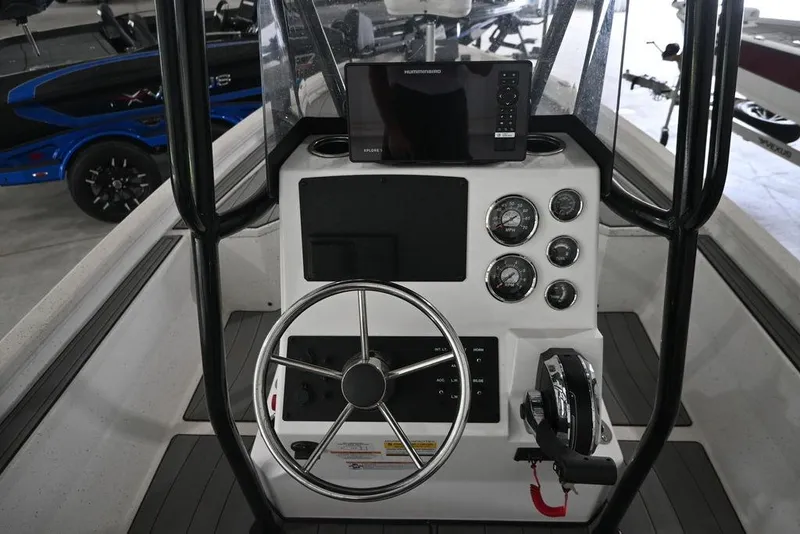 Slide: The Image of 2023 Vexus AVX2180CC boat console with steering wheel and navigation instruments. - 10