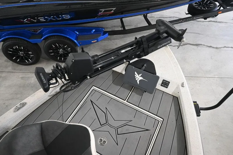 Slide: The Image of 2023 Vexus AVX2180CC boat with Garmin equipment on deck, blue trailer visible. - 12