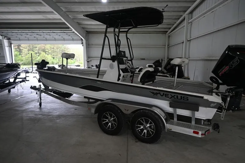 Slide: The Image of 2023 Vexus AVX2180CC boat in a garage, featuring sleek design and modern equipment. - 3