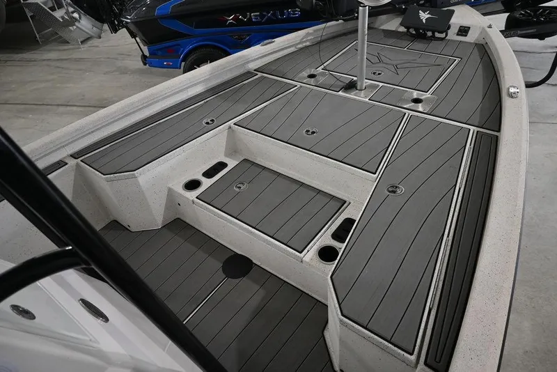 Slide: The Image of 2023 Vexus AVX2180CC boat deck with storage compartments and sleek design. - 7