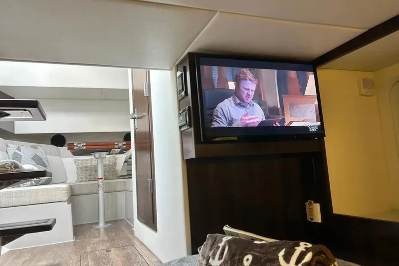 Slide: The Image of Interior of 2023 Cruisers Yachts 38 GLS OB with TV and cozy seating area. - 18