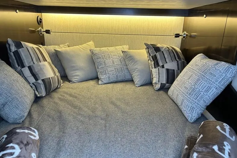 Slide: The Image of Luxurious cabin interior of 2023 Cruisers Yachts 38 GLS OB with plush pillows. - 19