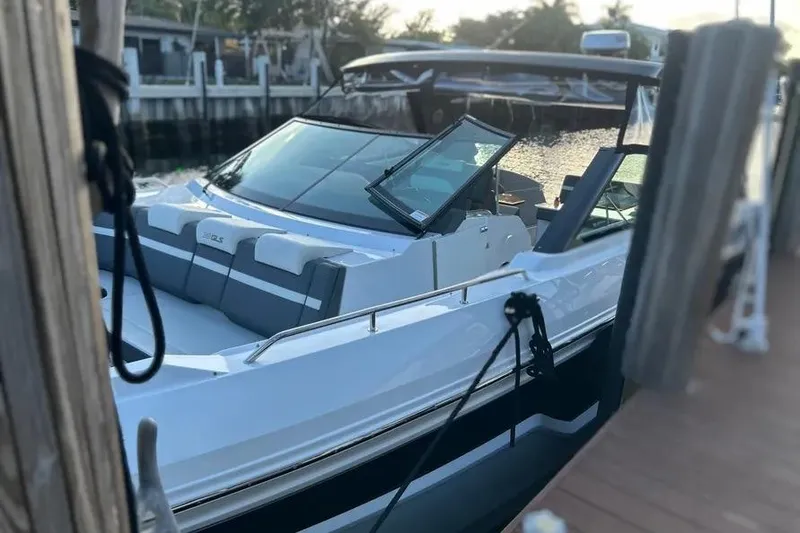 Slide: The Image of 2023 Cruisers Yachts 38 GLS OB docked at marina, sleek design, luxury features. - 21