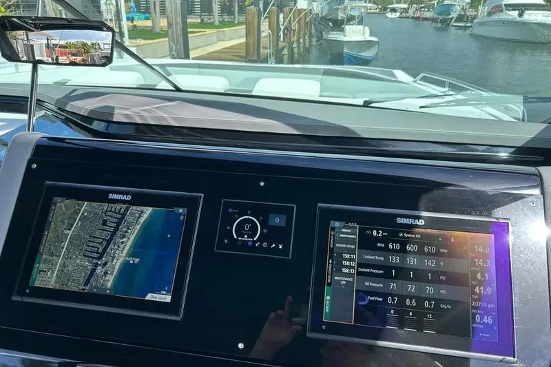 Slide: The Image of Dashboard of 2023 Cruisers Yachts 38 GLS OB with navigation and engine displays. - 28