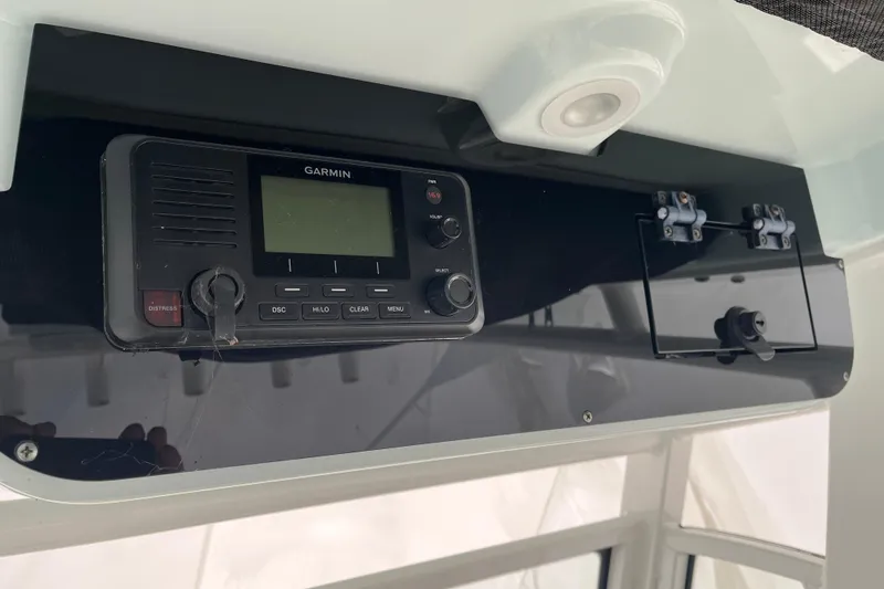 Slide: The Image of Garmin marine radio on 2022 Edgewater 230CC boat dashboard. - 4