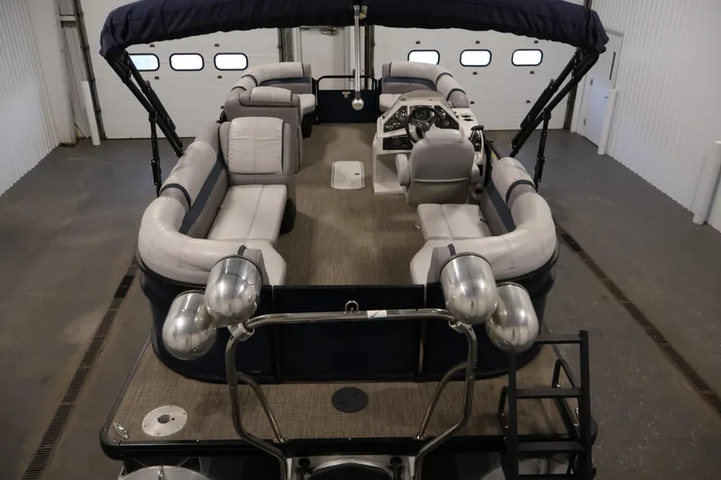 Slide: The Image of 2018 Sweetwater 2186 pontoon boat interior with seating and steering console. - 10