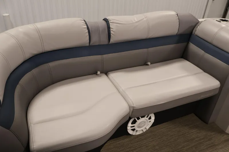 Slide: The Image of 2018 Sweetwater 2186 boat interior with plush seating and integrated speaker. - 15