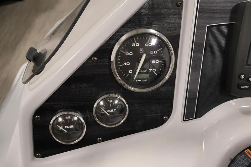 Slide: The Image of Dashboard of 2018 Sweetwater 2186 boat with speedometer, fuel, and volt gauges. - 21