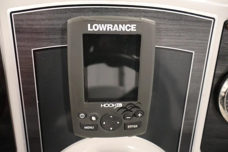 Slide: The Image of Fishfinder device on a 2018 Sweetwater 2186 boat dashboard. - 22