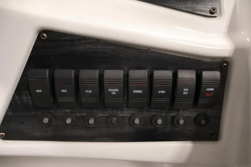 Slide: The Image of Control panel of a 2018 Sweetwater 2186 boat with labeled switches. - 25