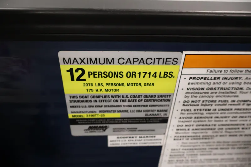 Slide: The Image of Maximum capacity label for Sweetwater 2186 boat, 12 persons or 1714 lbs, 2018 model. - 26