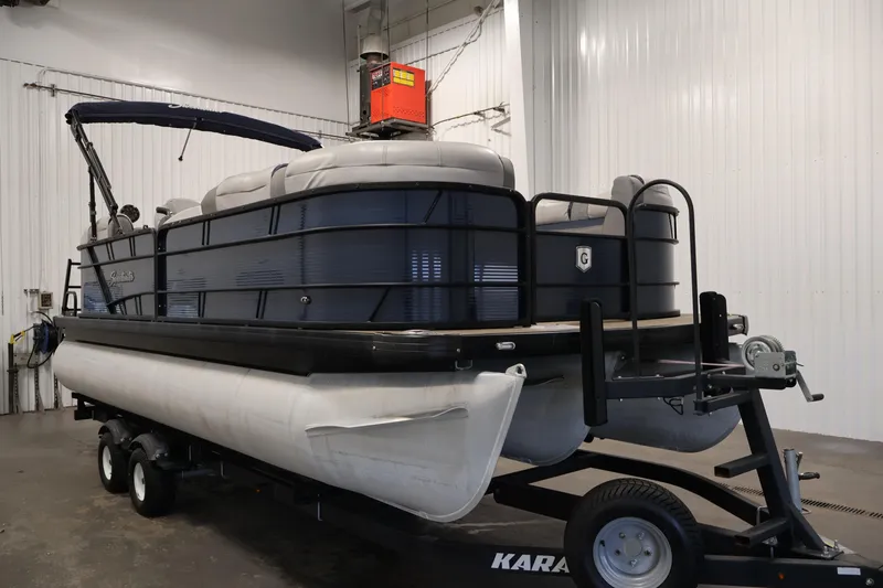 Slide: The Image of 2018 Sweetwater 2186 pontoon boat on trailer in indoor storage facility. - 3