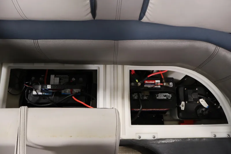 Slide: The Image of Batteries installed in a 2018 Sweetwater 2186 boat, under cushioned seating. - 35